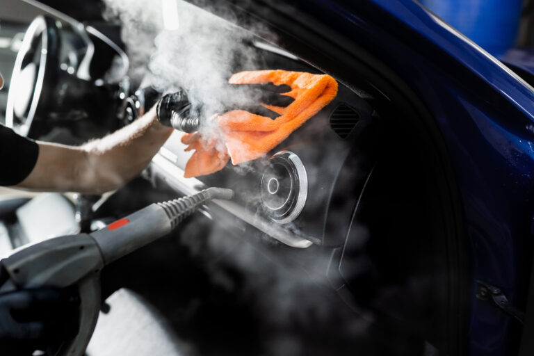 Steam-cleaning-of-car-air-system-Worker-in-auto-cleaning-service-clean-car-inside-Car interior-detailing